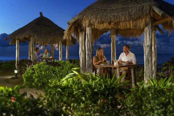 A romantic anniversary dinner in a beachfront cabana at sunset at Galley Bay Resort & Spa Antigua