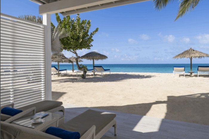 Two dedicated sun loungers on the beach at Galley Bay Resort & Spa
