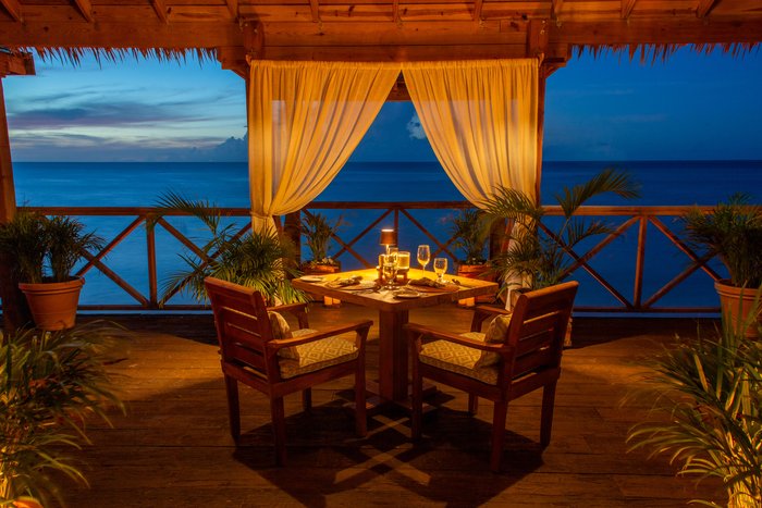 A celebratory toast with cocktails overlooking the ocean at Galley Bay Resort & Spa Antigua