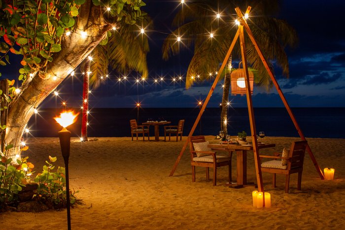 A romantic Caribbean sunset on the white-sand beach at Galley Bay Resort & Spa Antigua