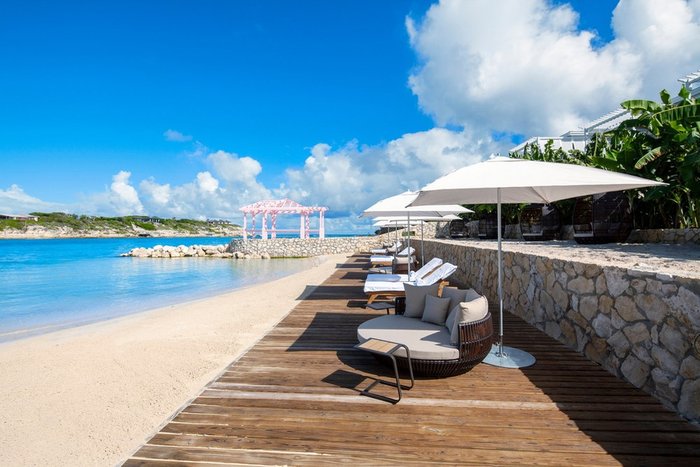Beach loungers in a private gazebo with ocean views at Hammock Cove Antigua