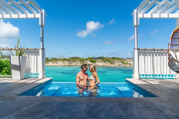 A private villa terrace with ocean views at Hammock Cove Antigua