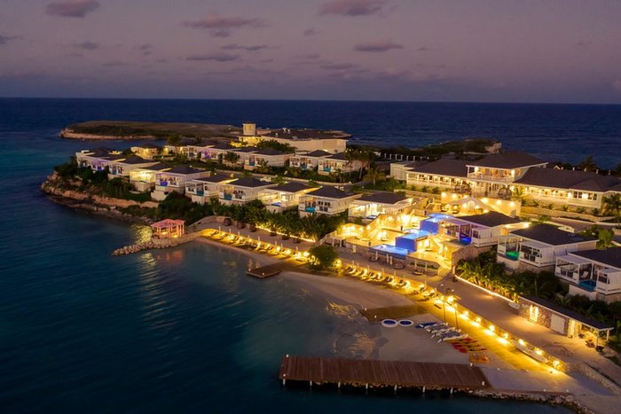 An aerial view of the villas, pool, and beach at Hammock Cove Antigua
