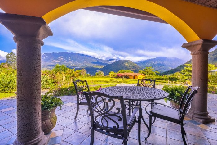 Sun loungers by the mountain-view pool at Los Establos Boutique Resort Panama