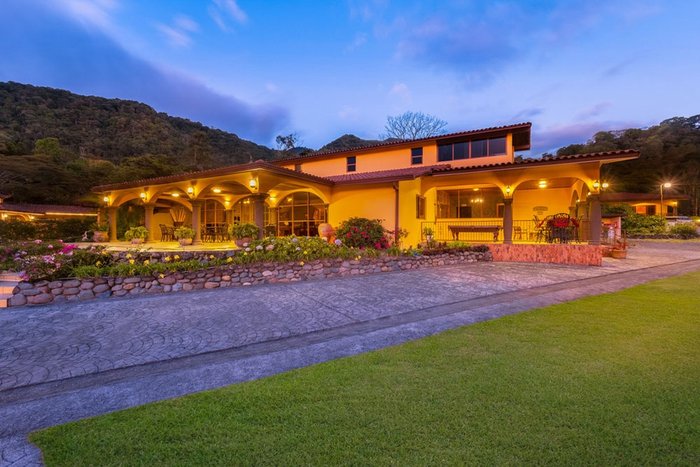 A tropical villa garden at dusk at Los Establos Boutique Resort Panama