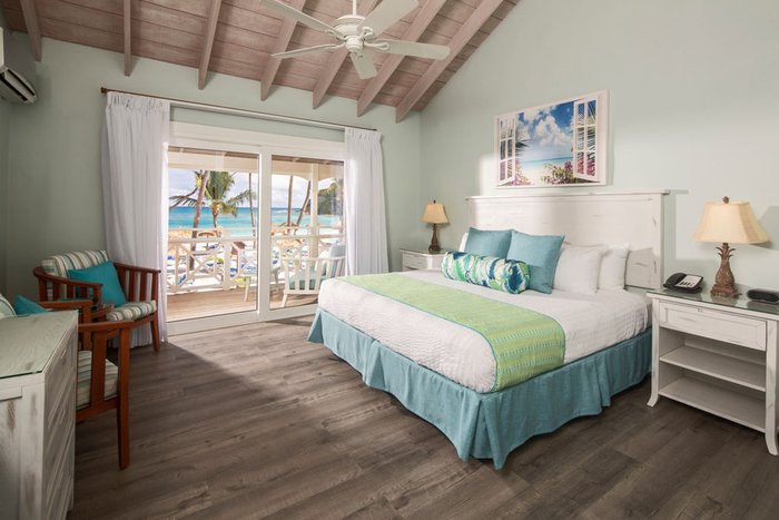 A private balcony with tropical pool view at Pineapple Beach Club Antigua