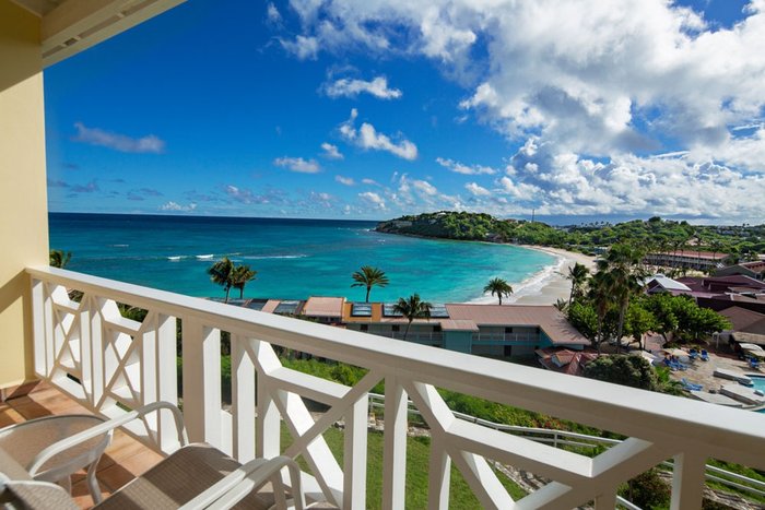 Palm trees and ocean views from the beach at Pineapple Beach Club Antigua