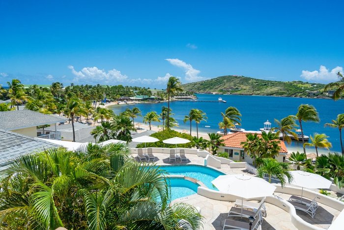 Families enjoying poolside fun at St. James's Club & Villas Antigua