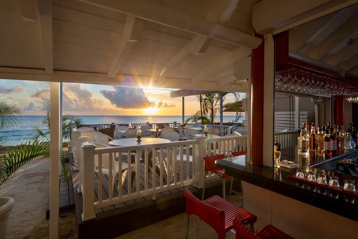 Sunset happy hour drinks on the beach at The Club Barbados