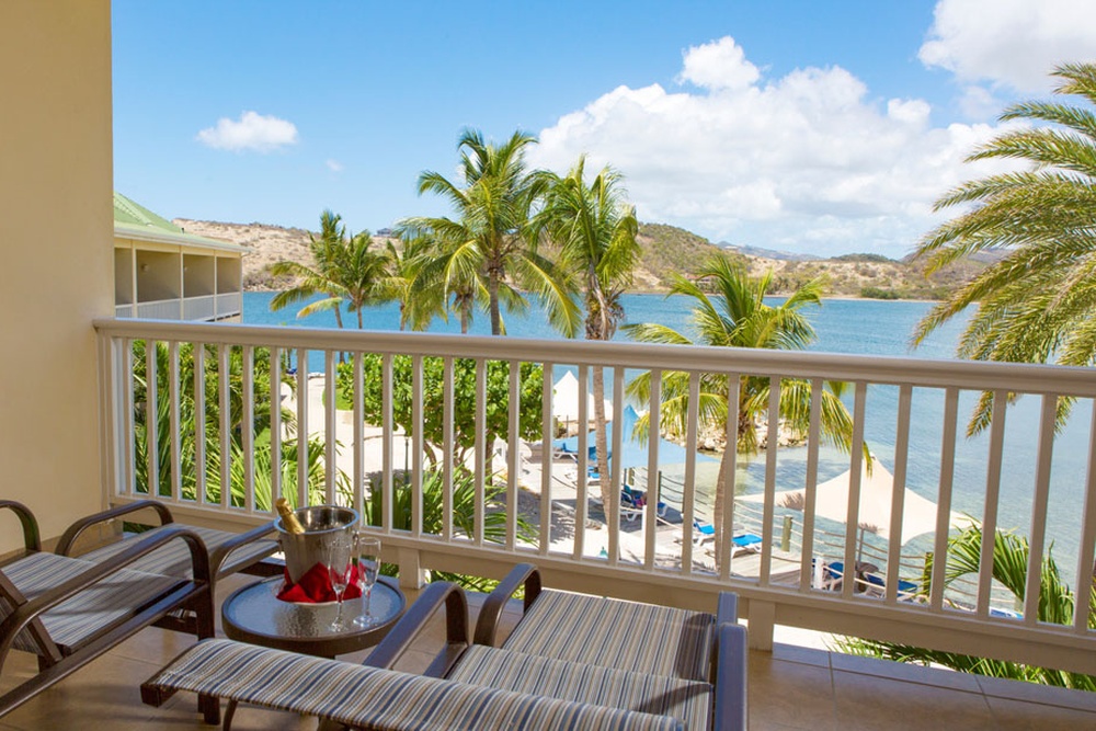 A premium-room balcony with bay views at St. James's Club & Villas Antigua