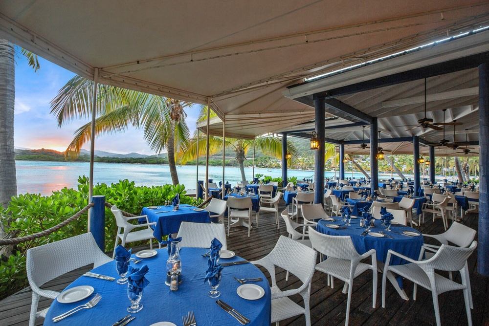 Beachfront dining at The Docksider with bay views at St. James's Club & Villas Antigua