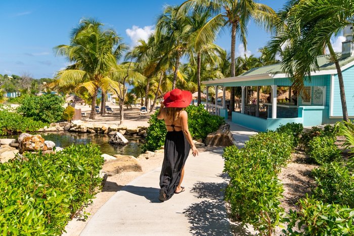 A couple raising a glass to a special occasion at The Verandah Antigua